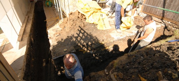 The team digging out the foundations by hand