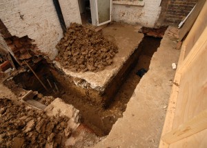 The foundation trench dug by hand