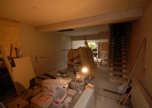 Plaster boarding the living room and kitchen open area downstairs