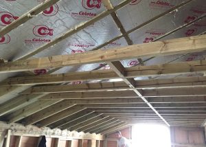 The insulation is being fitted inside the roof on this Fulham loft conversion